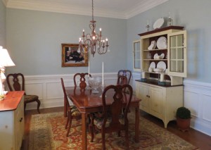 The restful Paladian Blue paint and new light fixture make the dining room light and airy.