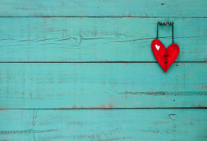 Blank wood sign with broken red heart